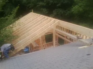 Framing a new roof addition that ties into an existing shingle roof in Medicine Lodge